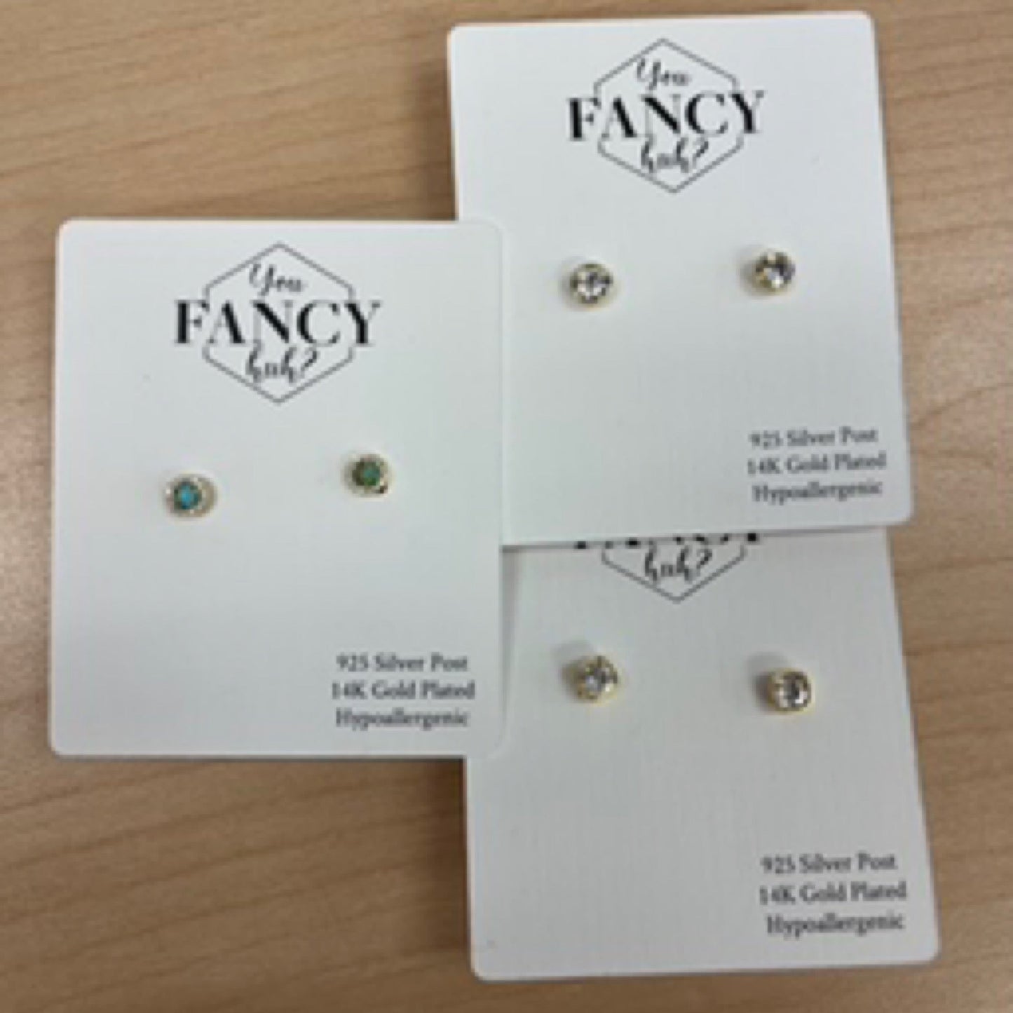 You fancy huh earrings (studs)
